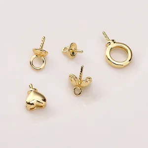 Detailed view of assorted 14K gold plated heart and leaf peg bails for DIY jewelry making