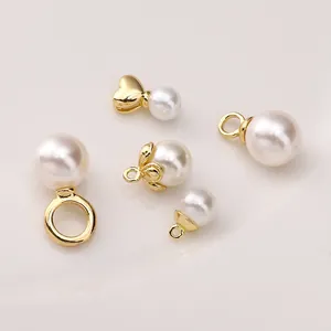 Macro view of 14K gold-plated heart and flower pearl pendant caps for DIY jewelry