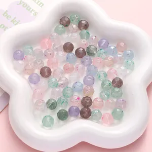 Macro detail of faceted 10mm earth beads in macaron colors for DIY jewelry making