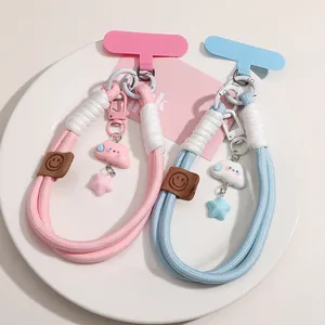 Detail of woven phone lanyard sets with cartoon star charms and matching spacer pads