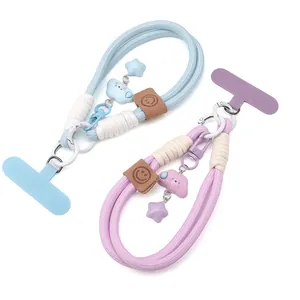 Detail of hand-woven phone lanyards with star and cloud charms plus secure gaskets