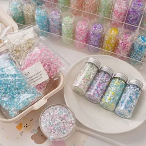 Colorful mixed glass seed beads set in glass jars and bags for DIY jewelry making