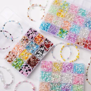 Flat lay of colorful glass seed bead kits in 24-grid organizers with handmade bracelets
