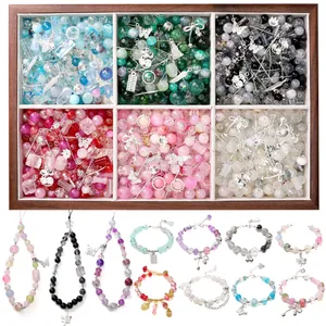 DIY colorful glass bead kit with silver charms and handmade bracelets in a wooden box