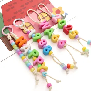 Handmade colorful acrylic letter bead keychains with Happy and 1988 text charms
