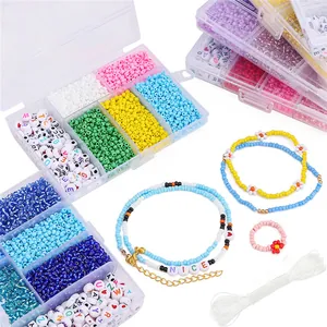 Macro view of DIY jewelry kit with 3mm beads, letter beads and colorful finished necklaces