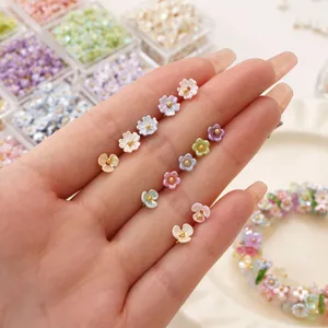 Macro shot of colorful resin lily of the valley flower beads for DIY jewelry making