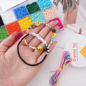 Detail showing two handmade beaded bracelets with 3mm glass beads and lucky letter charms