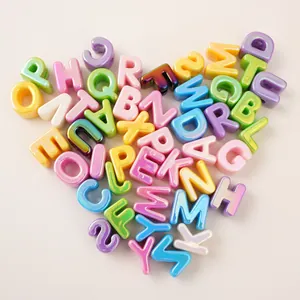 Close-up of heart-shaped colorful iridescent acrylic alphabet beads for DIY jewelry making