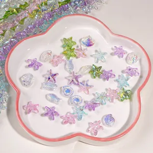 Macro view of ocean-themed AB coated starfish and shell glass beads for DIY jewelry