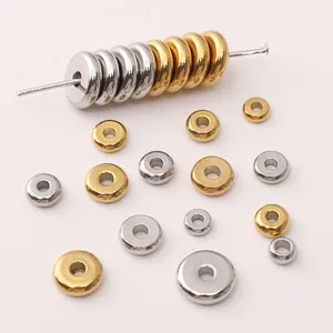 Polished stainless steel flat round spacer beads in silver and gold for DIY jewelry
