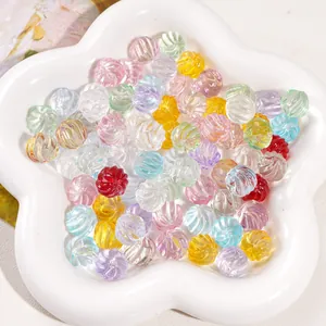 Macro view of 12mm colorful ribbed glass beads in a white star ceramic dish for DIY