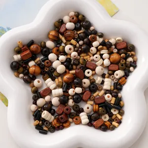Mix of vintage Chinese style wooden beads in various shapes and natural tones on a star tray