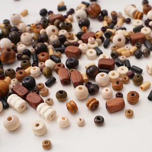 Macro shot of assorted wooden beads in various geometric shapes for DIY jewelry making