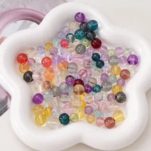 Macro shot of 8-10mm mixed multi-color transparent round glass beads for DIY jewelry