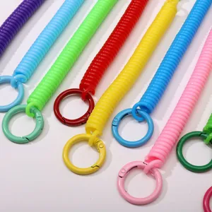 Colorful plastic spiral spring keychains with round metal carabiners in vibrant colors