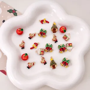 Detail of colorful Christmas enamel alloy pendants including Santa and festive tree designs
