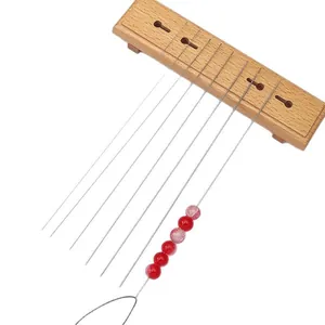 Wooden base with stainless steel beading needles and gradient beads for DIY jewelry