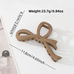 Elegant khaki bow hair claw clip made of matte resin shown with product dimensions