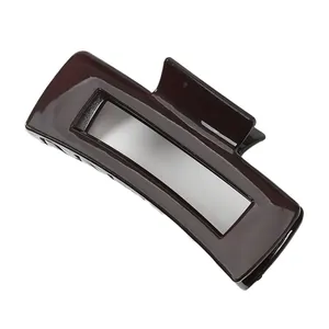 Glossy coffee brown rectangular hair claw clip with a hollow design for women