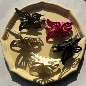 Set of five elegant hollow butterfly hair claws in matte finish assorted colors
