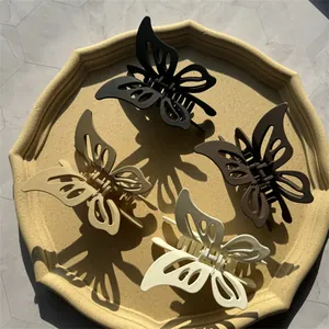 Elegant matte hollow butterfly hair claws in black, coffee, khaki, and cream colors