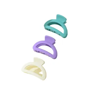 Detailed trio of matte mini hair claws in blue, purple, and beige colors