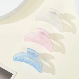 Detailed trio of matte small hair claws in white, pink, and blue for girls' styling