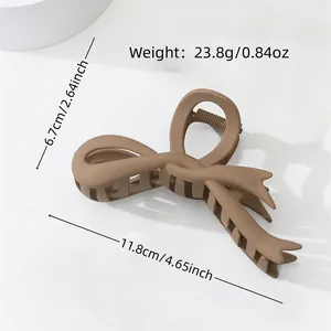 Matte brown bow hair claw clip measuring 11.8cm in length for women's daily styling