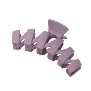 Close-up of a matte lavender wave hair claw clip featuring a crisscross tooth design