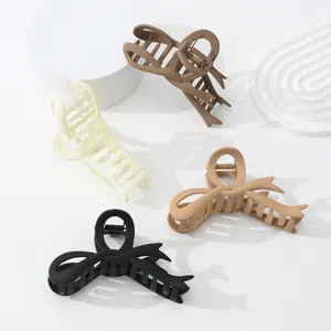 Matte finish ribbon claw clips set in cream, coffee, tan, and black for women