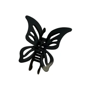 Elegant matte black hollow butterfly hair claw clip with double-layer wings on white background