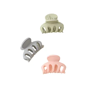 Three-piece set of mini matte hair claw clips in soft Morandi green, grey, and pink colors