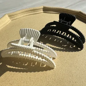 Matte milk coffee hair claw clips with shell design and beads in black and beige