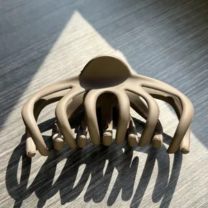 Close-up of a matte brown octopus hair claw clip with strong interlocking teeth for thick hair