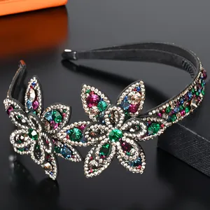 Close-up of vibrant floral headband with sparkling colorful Czech crystals on black band