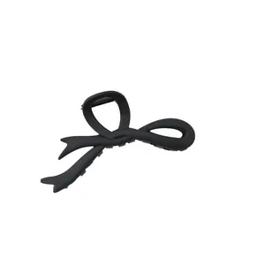 Matte black oversized hair claw clip featuring a creative ribbon bow design for women