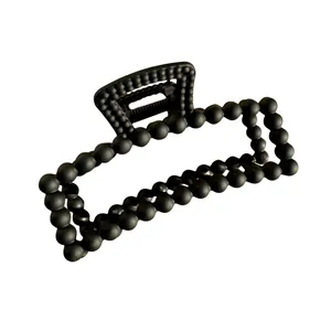 Matte black rectangle hair claw clip with ball bead texture for women's hairstyling