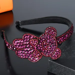 Macro view of crystal rhinestones and non-slip teeth detail on the purple bear headband