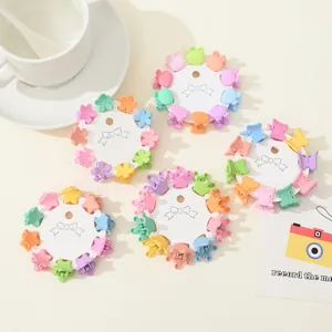 Detailed macro view of colorful mini hair claws in various shapes on display cards
