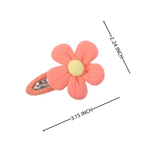 Cute pink fabric flower hair clip for girls with yellow center and dimensions scale