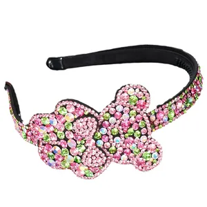 Sparkling crystal bear headband with colorful rhinestones on a black tooth comb base