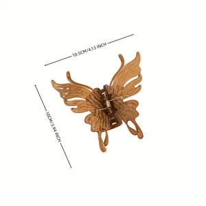 Detail view of a 10.5cm amber butterfly hair claw clip with size measurements