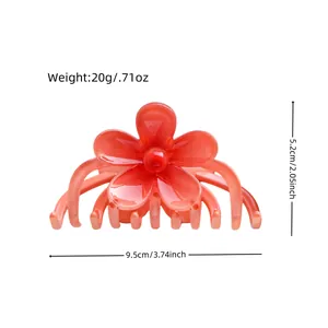 Matte orange frangipani flower hair claw clip with size dimensions and weight info