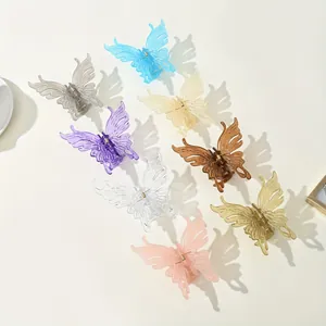 Flat lay of eight colorful translucent butterfly hair clips with sturdy metal springs