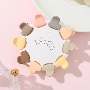 Close-up of 10-piece matte heart mini hair clips in assorted colors on display card