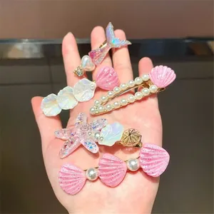 Ocean themed hair clip set with pearl starfish and shells in pink and iridescent white