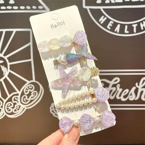 Detailed set of 5 ocean-themed hair clips with pearls and shimmering sea shells