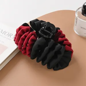 Elegant large fabric hair claw clip with red and black pleated layers for thick hair