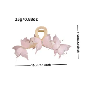 Pink butterfly hair claw clip for women made of yellow acrylic with pearls and rhinestones